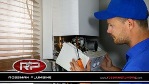 Plumber Repairing a Tankless Water Heater